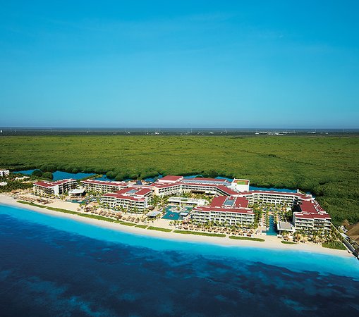 Breathless Riviera Cancun adults-only all-inclusive resort with vibrant pool scene, beachfront setting, and social atmosphere near Cancun.