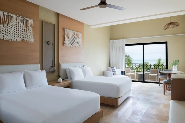Club Level Junior Suite Oceanfront Double with two beds and balcony view at Hyatt Zilara Riviera Maya.