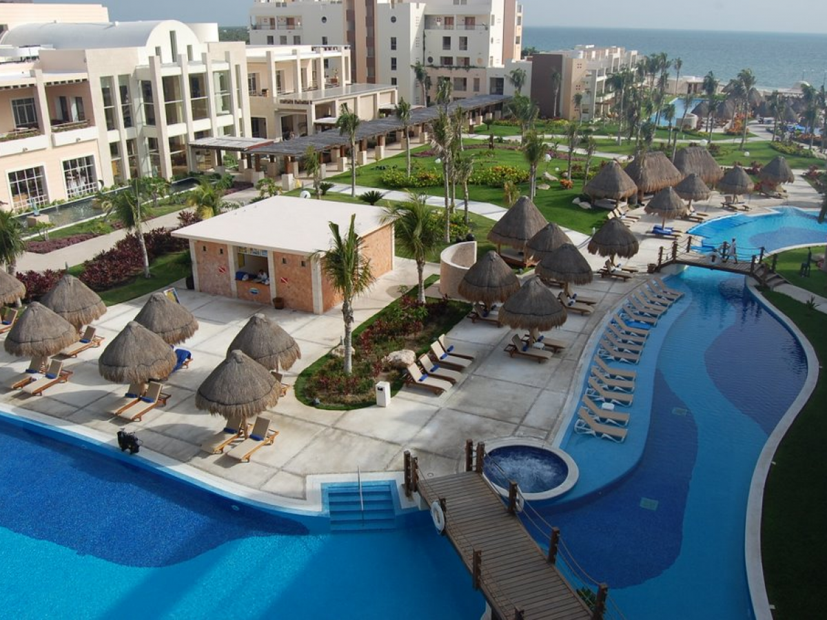 Excellence Playa Mujeres luxury adults-only all-inclusive resort with pristine beach, rooftop terraces, and modern suites near Cancun.