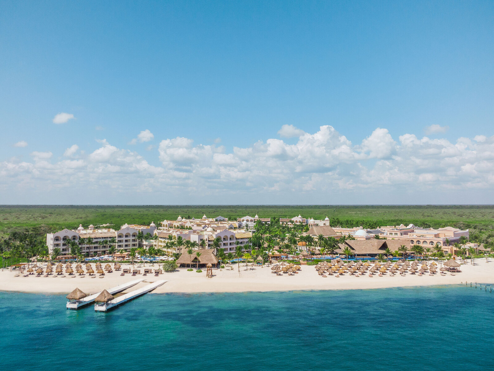 Excellence Riviera Cancun adults-only all-inclusive resort with pristine beach, elegant pools, and romantic luxury atmosphere.