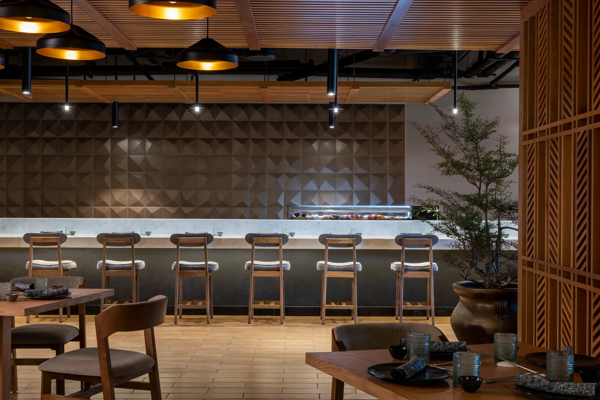 Tempest Asian restaurant at Hyatt Zilara Riviera Maya featuring a modern sushi bar, warm ambient lighting, and minimalist Japanese-inspired design.