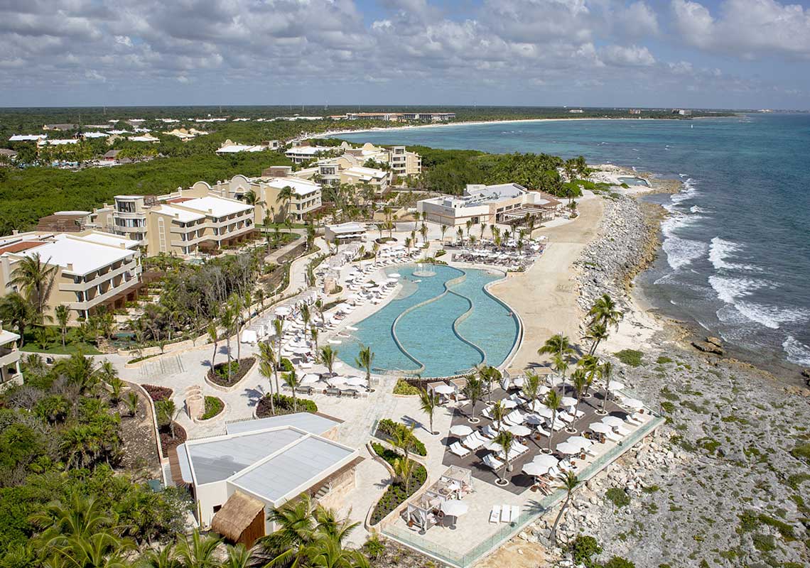 TRS Yucatan Hotel adults-only luxury all-inclusive resort in Riviera Maya with modern suites, infinity pools, and premium amenities.